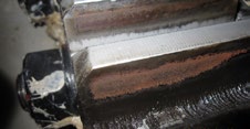 Initiation phase of fretting corrosion of manually lubricated pitch gears. Eight years later, these gear teeth are nearing functional failure.