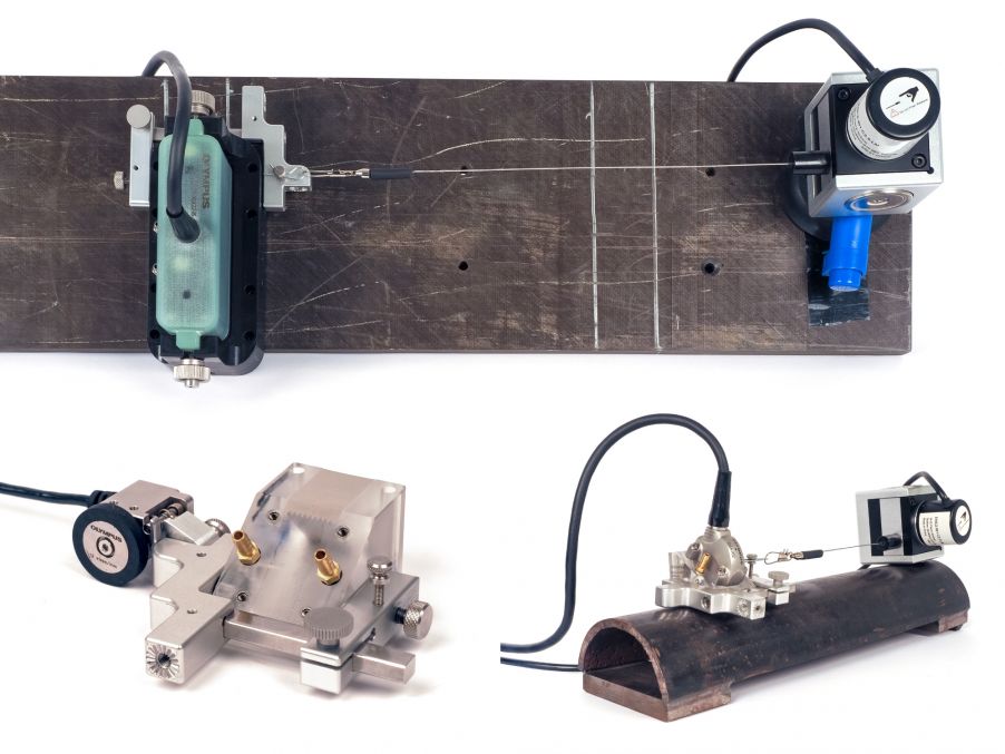 钢线编码器、通用托架和 Mini-Wheel(袖珍轮)编码器组合在一起使用的图像