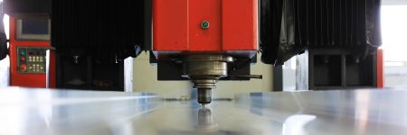 Friction stir welding rotating machining tool in an automated system welding a steel plate